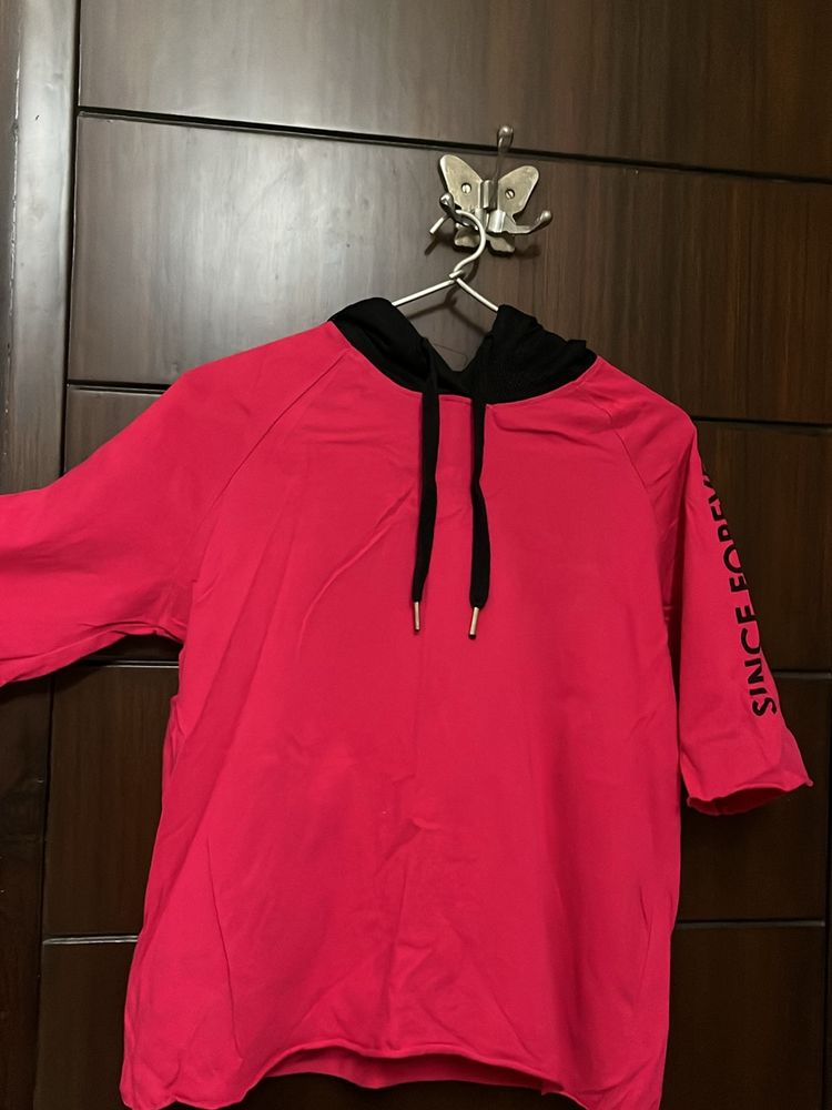 A Hooded Medium Length Half Sleeves Top