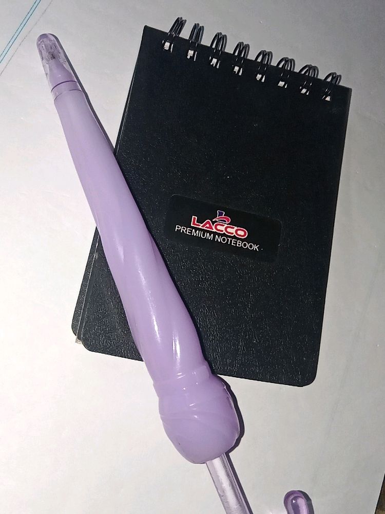 Cute Purple Pen And A Small Notepad..