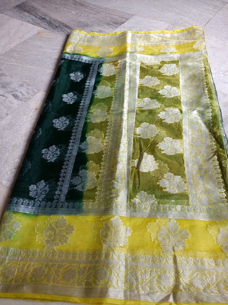 A Bottle Green Colour Saree With Yellow Border