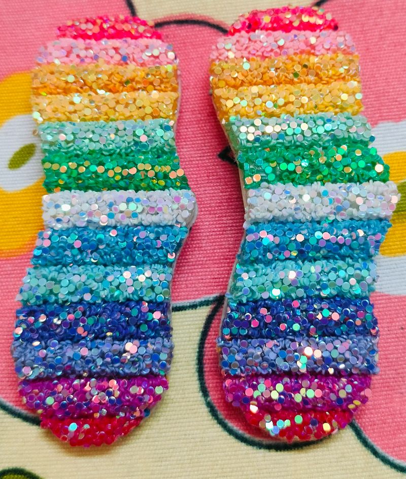 A Pair Of Glittery Rainbow Clips