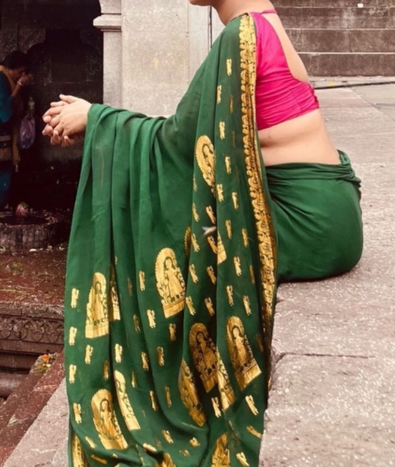 Green Saree With Pink Sleevless Blouse