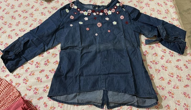 denim top with threaded flowers