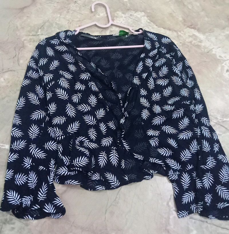 black shrug with leaf print