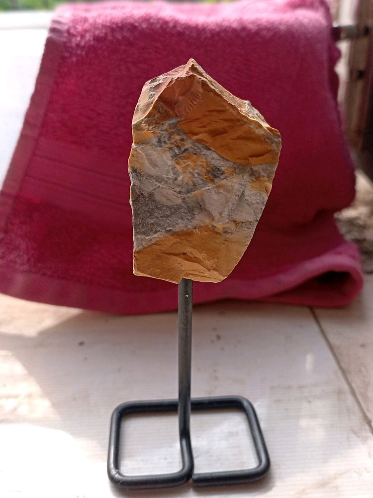 ROUGH CRYSTAL ROCK IN A STAND