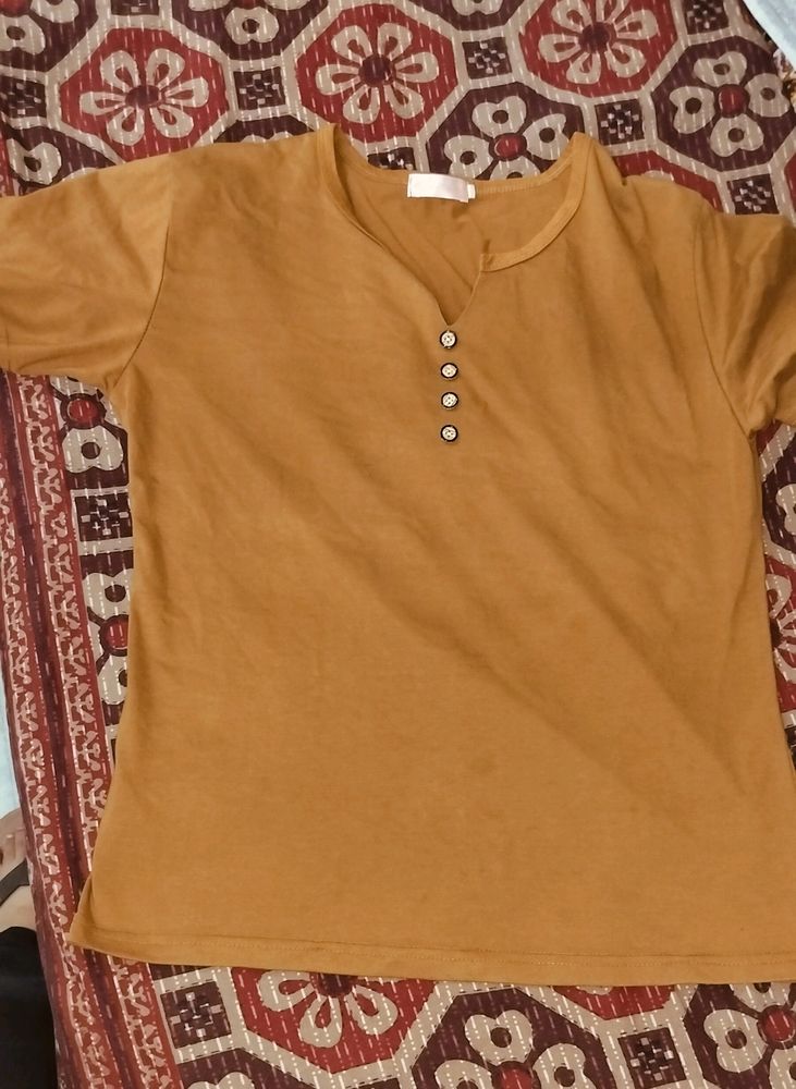 A T-shirt In Brown Colour