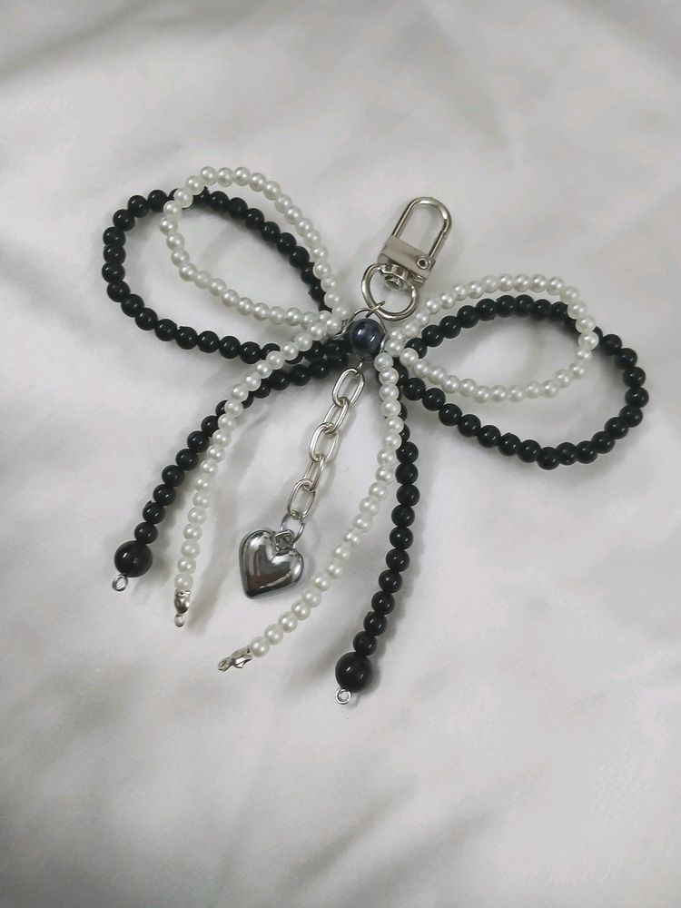 ₊˚⊹౨ bow beaded bagcharm ৎ ₊˚⊹