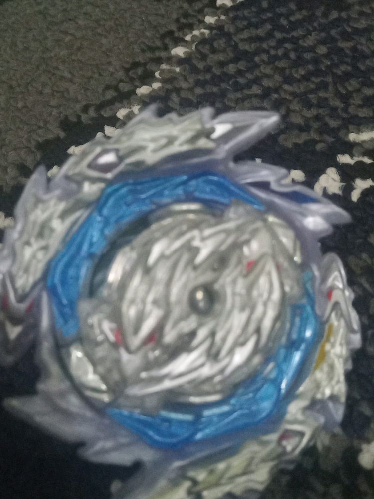 A Metallic Beyblade With Free Bracelet