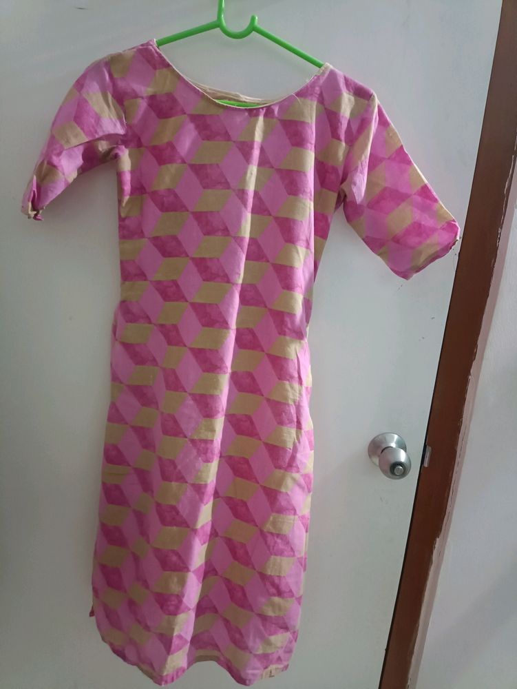 A pink Coloured stitched Kurti