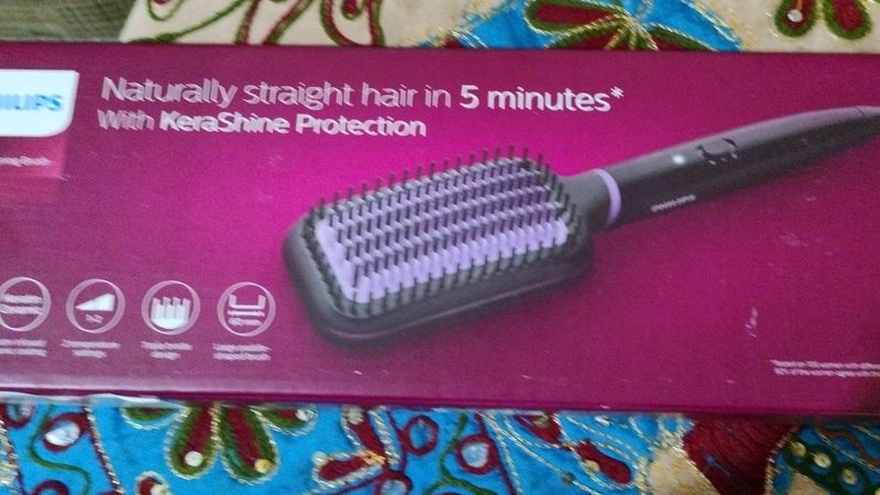 A BRAND NEW PHILIPS HAIR STRAIGHTENER.