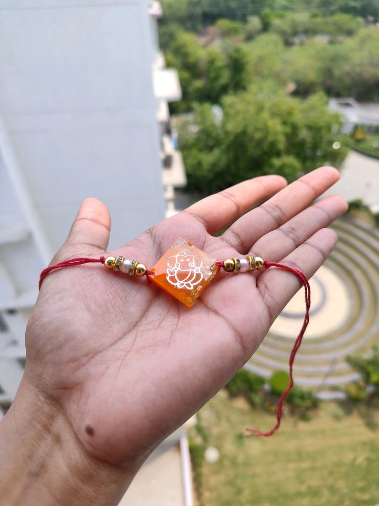 Orange Ganeshji Resin Rakhi